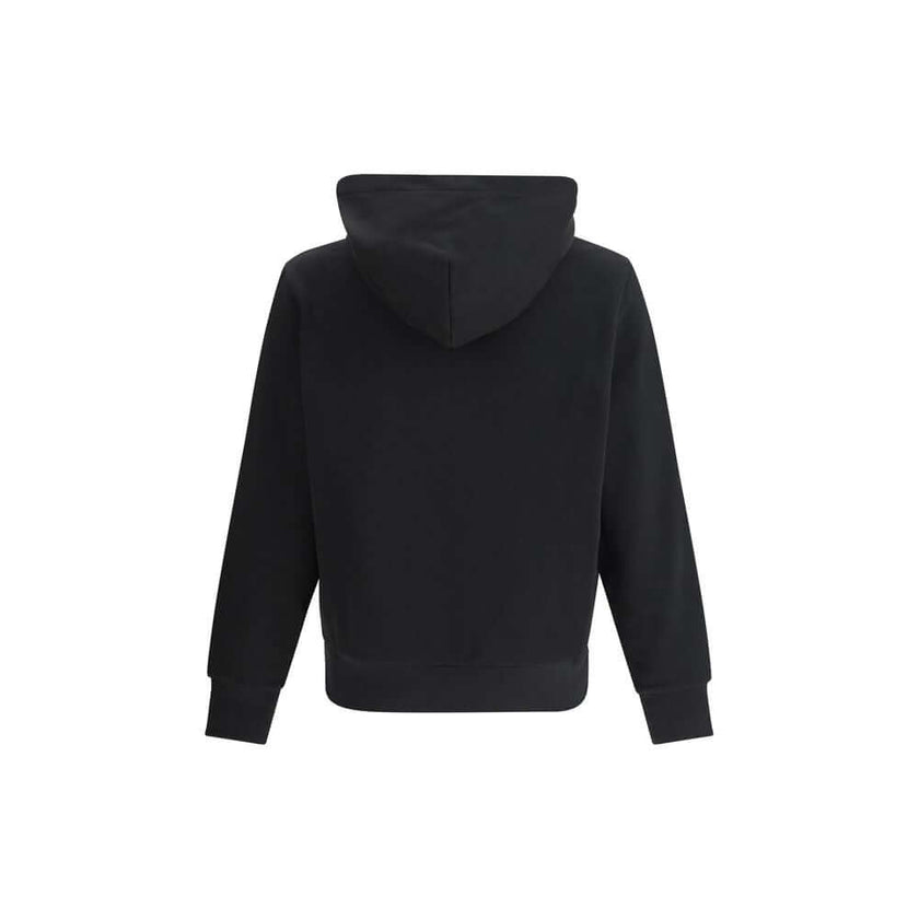 Black Cotton SweatshirtThe cotton hooded Sweatshirt by Moncler is a timeless casual essential reimagined with a distinctive touch. Crafted from soft cotton jersey, it features an adjustable hood, ribbed trims, and the iconic star-shaped logo patch on the