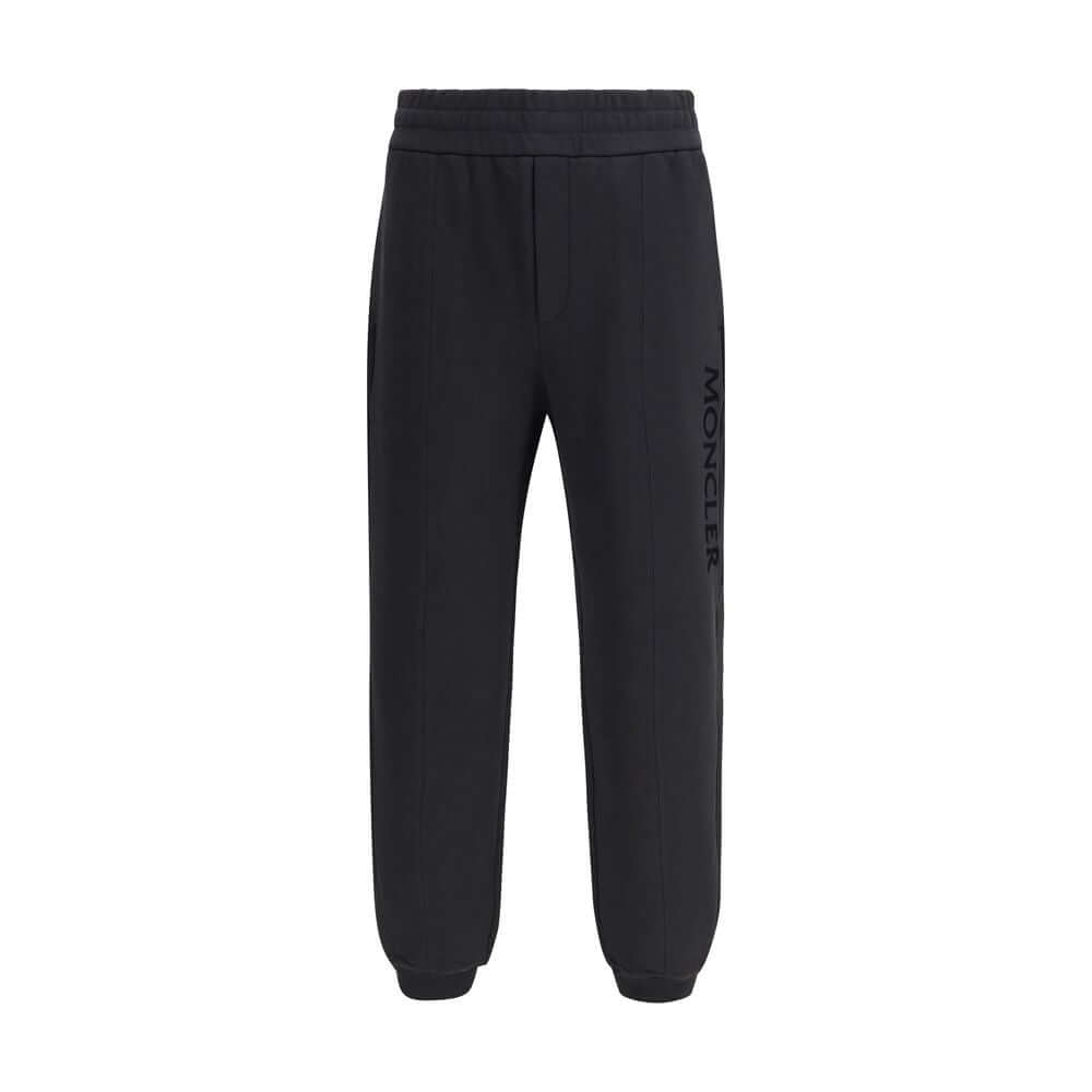 Black Cotton SweatshirtThe cotton Sweatpants by Moncler combine comfort and style in a clean, contemporary design. Made from soft cotton jersey, they feature an adjustable drawstring waist, side pockets, and a rear welt pocket. The tone-on-tone flocked lo