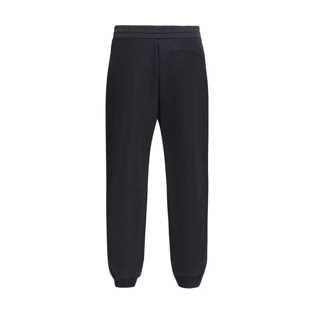 Black Cotton SweatshirtThe cotton Sweatpants by Moncler combine comfort and style in a clean, contemporary design. Made from soft cotton jersey, they feature an adjustable drawstring waist, side pockets, and a rear welt pocket. The tone-on-tone flocked lo