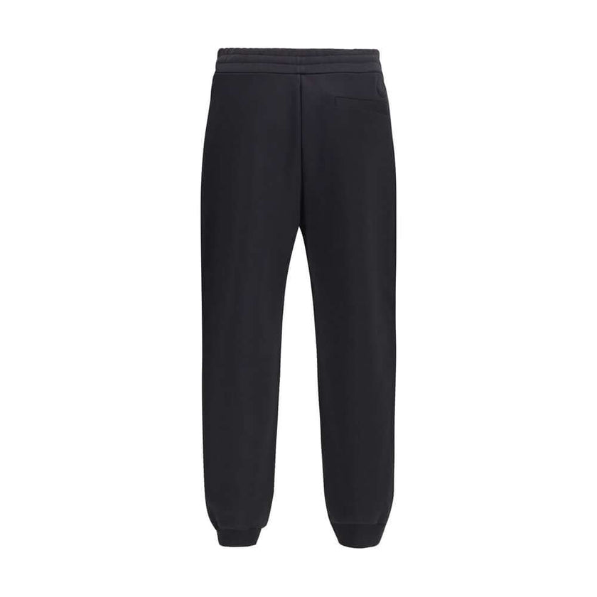 Black Cotton SweatshirtThe cotton Sweatpants by Moncler combine comfort and style in a clean, contemporary design. Made from soft cotton jersey, they feature an adjustable drawstring waist, side pockets, and a rear welt pocket. The tone-on-tone flocked lo