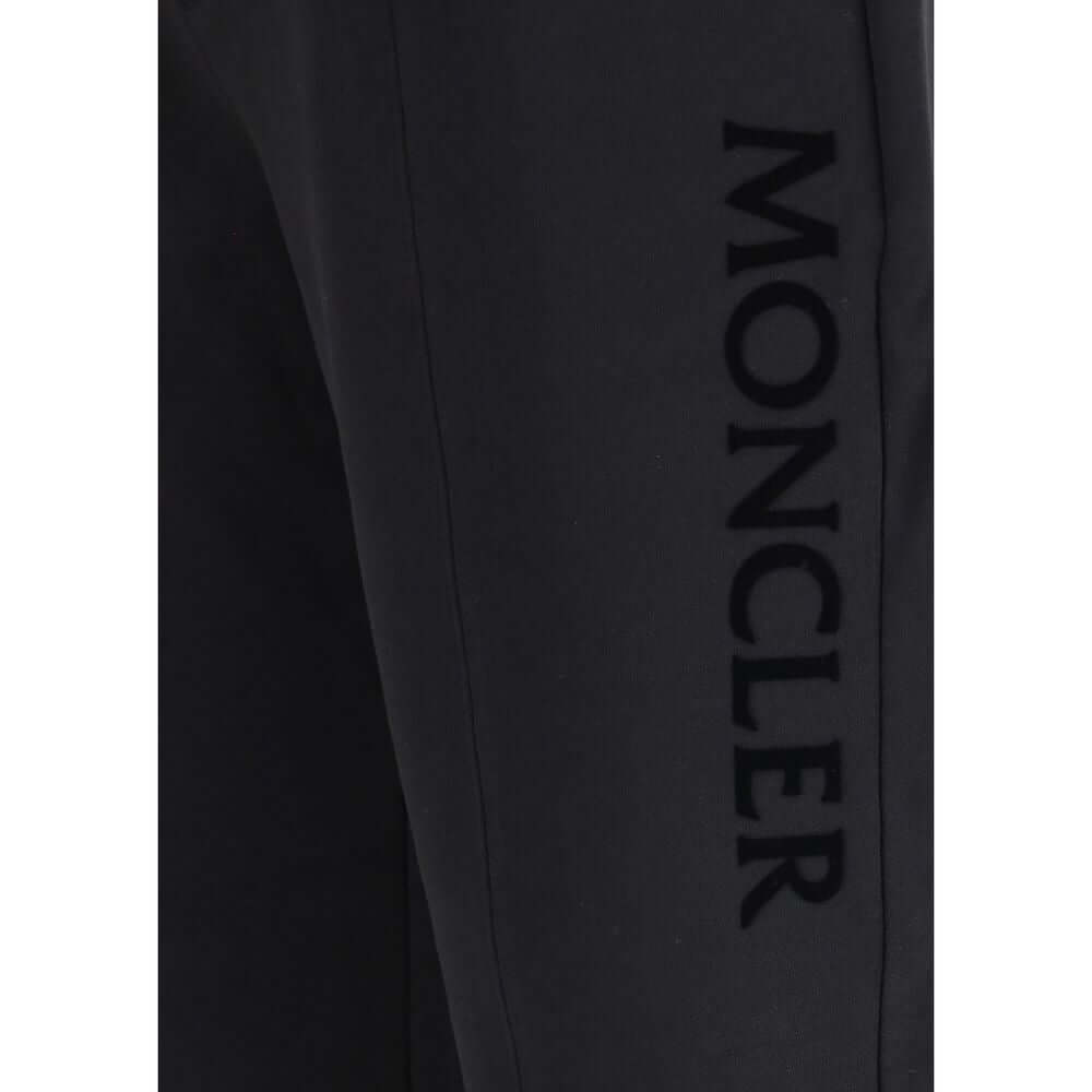 Black Cotton SweatshirtThe cotton Sweatpants by Moncler combine comfort and style in a clean, contemporary design. Made from soft cotton jersey, they feature an adjustable drawstring waist, side pockets, and a rear welt pocket. The tone-on-tone flocked lo