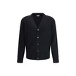 Black Fleece Wool CardiganThe wool V-Neck Cardigan by Moncler embodies the refined minimalism of the Men’s collection. Crafted from carded wool in a gauge 7 plain knit, it offers a clean, versatile silhouette ideal for a polished and modern look. The desi