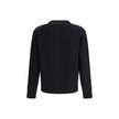 Black Fleece Wool CardiganThe wool V-Neck Cardigan by Moncler embodies the refined minimalism of the Men’s collection. Crafted from carded wool in a gauge 7 plain knit, it offers a clean, versatile silhouette ideal for a polished and modern look. The desi