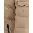 Beige Polyamide Full-Length JacketThe Moncler Grenoble Montgetech Ski Down Jacket with Hood, designed for peak performance in skiing and snowboarding. Crafted from 2L 4-way stretch nylon, it provides exceptional flexibility and weather resistance. The pad