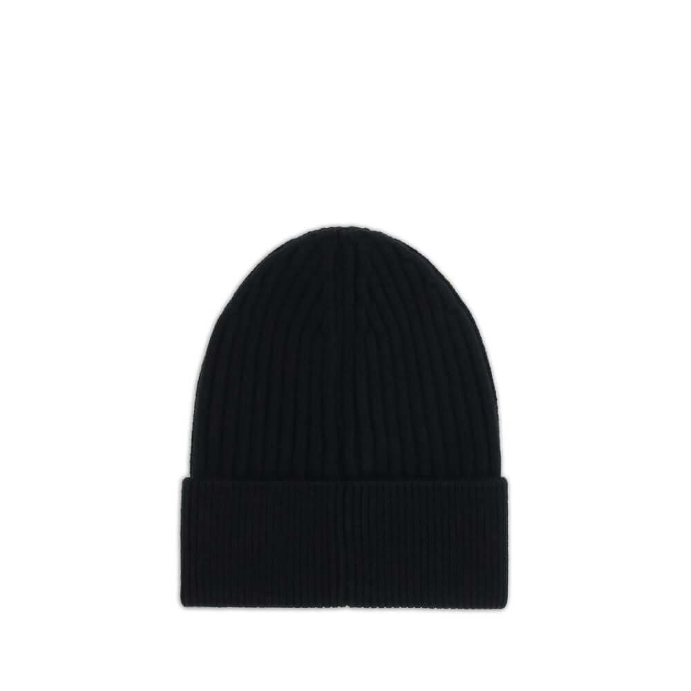 Black Fleece Wool BeanieBeanie Hat by Moncler Grenoble combines functionality and style in an essential cold-weather accessory. Made with ribbed fabrication, it offers a snug and comfortable fit. The Moncler Grenoble logo sewn on the front adds a distinct