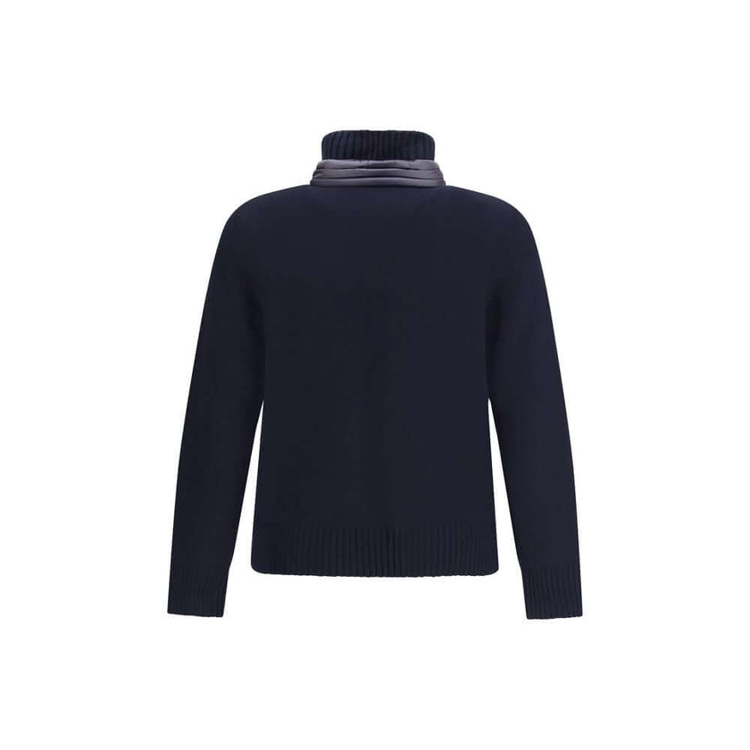 Panelled JacketThe panelled Jacket by Moncler Grenoble crafted from a wool blend, featuring a down-feather padded design that alternates quilted sections with knitted panels. It comes with a high neck, front zip fastening, long sleeves, and ribbed cuffs a