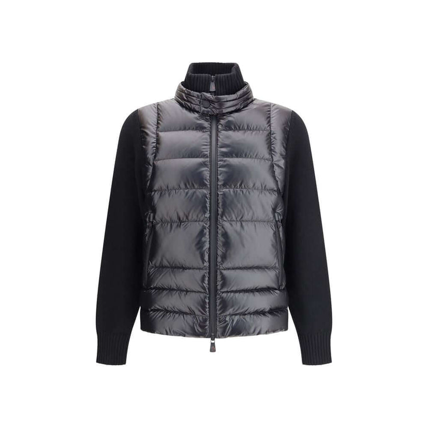 Panelled JacketThe panelled Jacket by Moncler Grenoble crafted from a wool blend, featuring a down-feather padded design that alternates quilted sections with knitted panels. It comes with a high neck, front zip fastening, long sleeves, and ribbed cuffs a