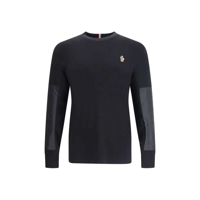 Black Polyamide SweatshirtThe panelled Sweater by Moncler Grenoble combines technical performance with refined craftsmanship. Made from a soft wool blend with padded inserts, it features a knitted construction enhanced by contrasting technical panels that
