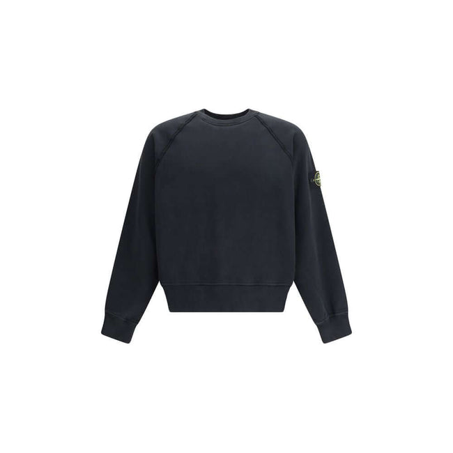 Cotton Crew neck SweatshirtThe Crew neck Sweatshirt by Stone Island is crafted from brushed organic cotton, offering a soft feel and a sustainable approach. Its design features raglan sleeves, overlock seams, and stretch ribbed finishes at cuffs and strai