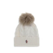 White Fleece Wool BeanieThe beanie Hat by Moncler Grenoble with pon pon is crafted from a premium wool and cashmere blend for warmth and comfort. It features a long-haired sheepskin pom pom and a 3-gauge Aran cable-knit cuff for a rich, detailed texture.