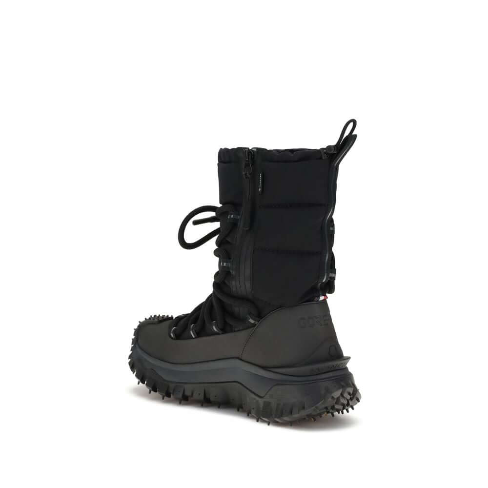 Black Polyamide Lace-Up BootsTrailgrip Après high Boots by Moncler are designed to tackle the most extreme conditions with style and functionality. The upper combines technical nylon and textured rubber for optimal protection, while the GORE-TEX membrane