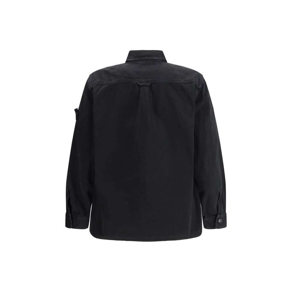 Black Cotton ShirtThe Stone Island Overshirt, crafted from 100% black cotton, is a versatile essential that blends functionality with contemporary style. Featuring a button fastening, two chest patch pockets, and the iconic logo patch on the left sleeve,
