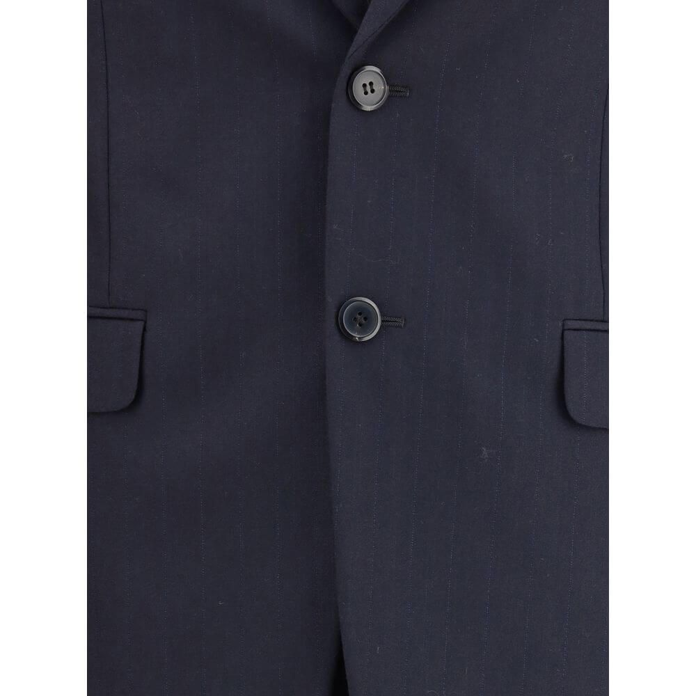 Blue Fleece Wool Two-Piece SuitThe single-breasted wool and cashmere Suit by Prada exemplifies refined tailoring and timeless sophistication. Crafted from a luxurious blend of wool and cashmere, it features a slim fit and meticulous attention to detail. T