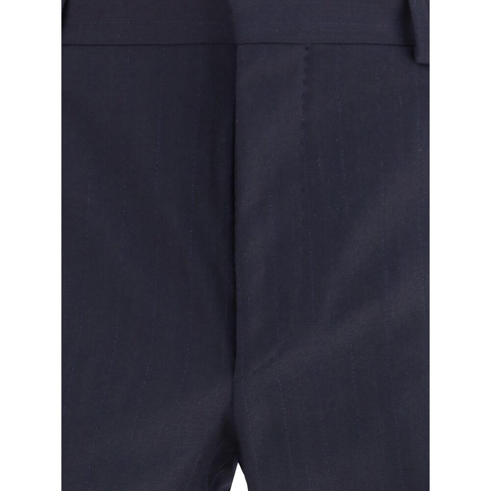 Blue Fleece Wool Two-Piece SuitThe single-breasted wool and cashmere Suit by Prada exemplifies refined tailoring and timeless sophistication. Crafted from a luxurious blend of wool and cashmere, it features a slim fit and meticulous attention to detail. T