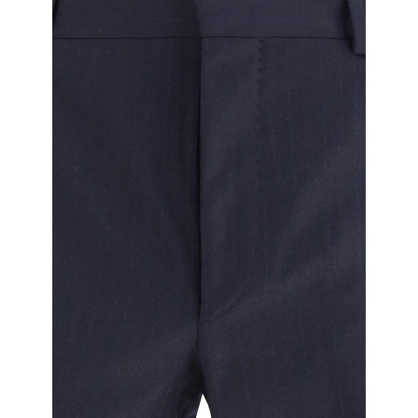Blue Fleece Wool Two-Piece SuitThe single-breasted wool and cashmere Suit by Prada exemplifies refined tailoring and timeless sophistication. Crafted from a luxurious blend of wool and cashmere, it features a slim fit and meticulous attention to detail. T