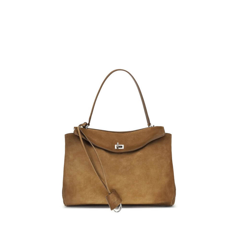 Brown Calf Leather Bos Taurus Shoulder BagThe Medium Rodeo Bag by Balenciaga blends sophistication and practicality with its combination of waxed suede calfskin and smooth leather. It features a top handle and a detachable shoulder strap for versatile car