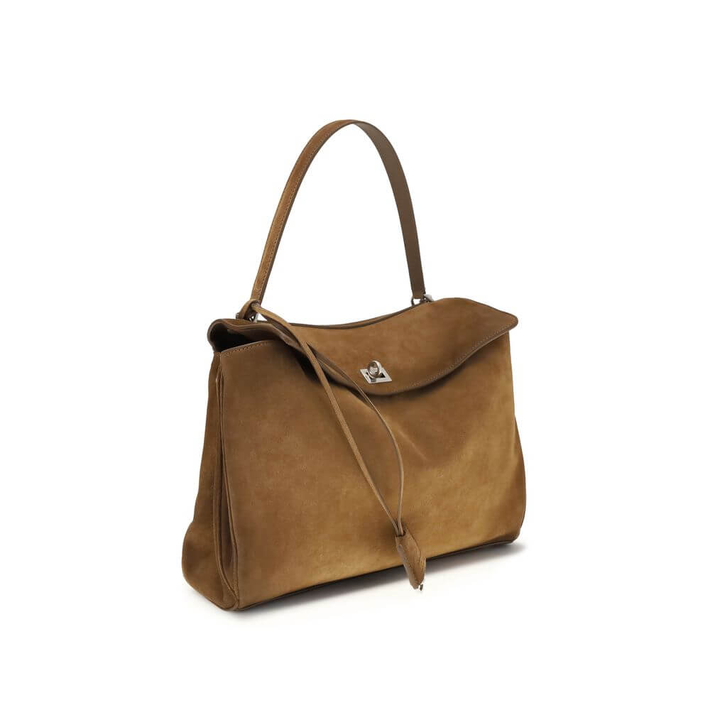 Brown Calf Leather Bos Taurus Shoulder BagThe Medium Rodeo Bag by Balenciaga blends sophistication and practicality with its combination of waxed suede calfskin and smooth leather. It features a top handle and a detachable shoulder strap for versatile car
