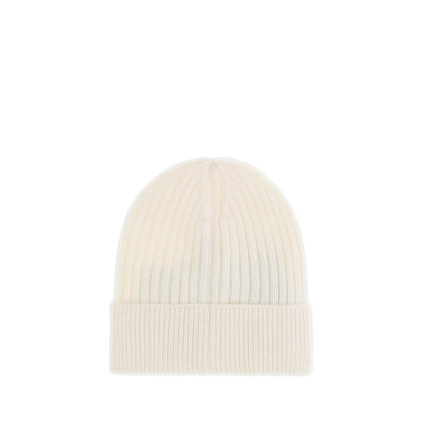 Cream Fleece Wool BeanieBeanie Hat by Moncler Grenoble combines functionality and style in an essential cold-weather accessory. Made with ribbed fabrication, it offers a snug and comfortable fit. The Moncler Grenoble logo sewn on the front adds a distinct