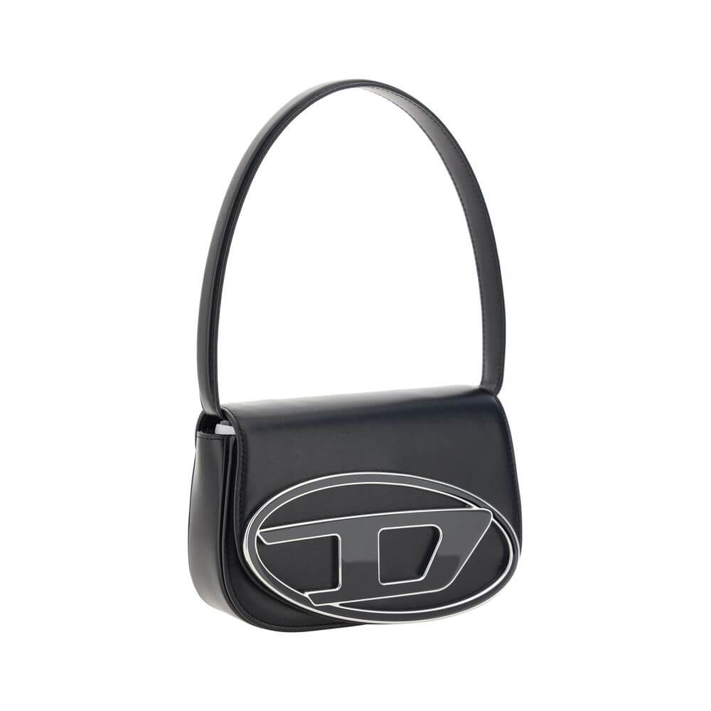 Black Calf Leather Bos Taurus Shoulder BagThe 1DR Shoulder Bag by Diesel is made of mirrored leather with a flat shoulder strap. It has a front magnetic closure and the brand’s embossed Oval-D logo. Inside is a welt pocket to keep items in order. A modern