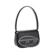 Black Calf Leather Bos Taurus Shoulder BagThe 1DR Shoulder Bag by Diesel is made of mirrored leather with a flat shoulder strap. It has a front magnetic closure and the brand’s embossed Oval-D logo. Inside is a welt pocket to keep items in order. A modern