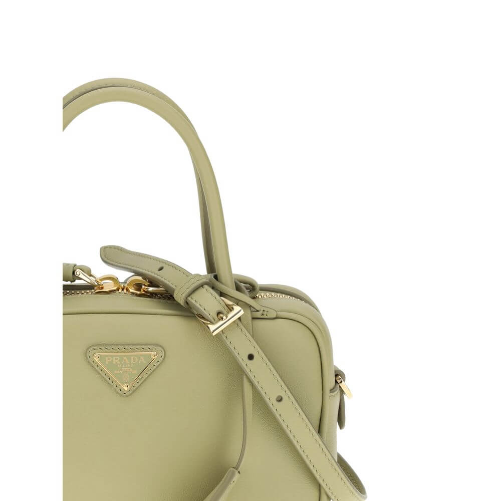 Green Calf Leather Bos Taurus HandbagThe Handbag by Prada combines elegance and functionality in an iconic design. Featuring two tubular handles and a zip closure, it is embellished with a triangular logo plaque on the front, the brand’s distinctive symbo