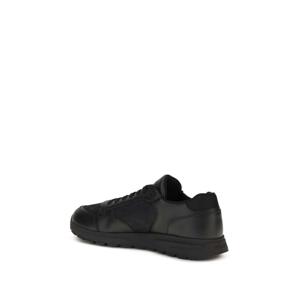 Black Recycled Polyamide Athletic SneakersSneakers by Prada, made of Re-Nylon and brushed leather, combine contemporary style and innovative materials. Equipped with laces, they feature an enameled triangle logo on the upper and screen-printed Prada Milan