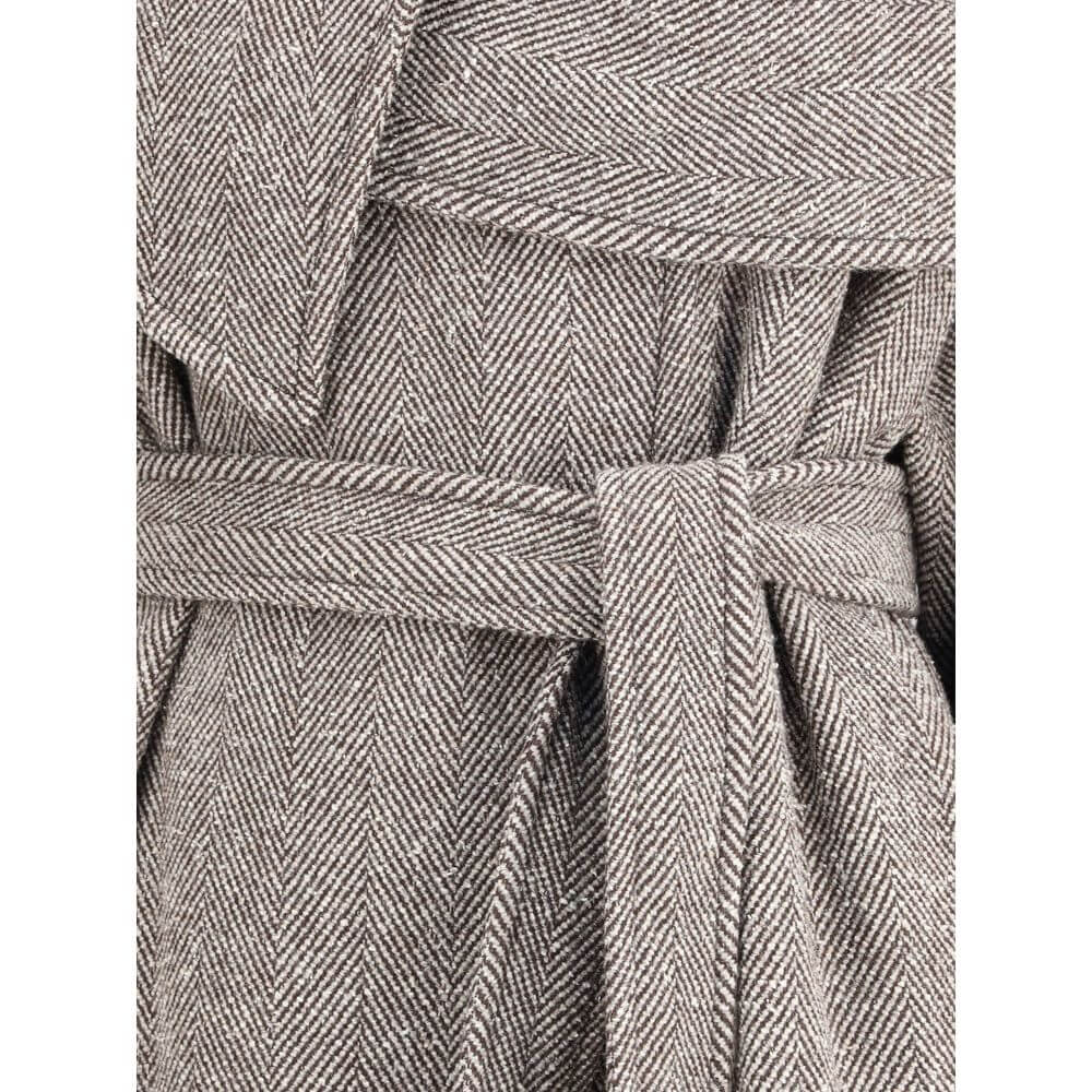 Brown Fleece Wool CoatThe oversized asymmetric Coat by Ferragamo embodies generous proportions and a soft chevron-textured bouclé fabric, offering a refined yet cozy allure. The couture-inspired cuts and fluid lines highlight the brand’s masterful tailori