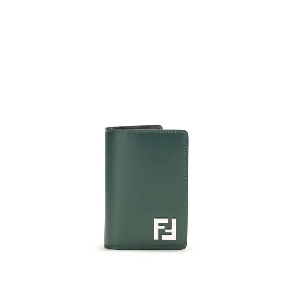 Black Calf Leather Bos Taurus WalletLeather Card Holder by Fendi is a compact and refined accessory, offered in a billfold model. The front features a three-dimensional plaque with the iconic FF logo, the distinctive symbol of the maison. The interior is