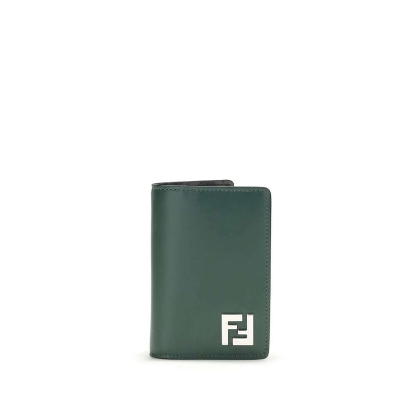Black Calf Leather Bos Taurus WalletLeather Card Holder by Fendi is a compact and refined accessory, offered in a billfold model. The front features a three-dimensional plaque with the iconic FF logo, the distinctive symbol of the maison. The interior is