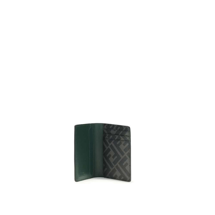 Black Calf Leather Bos Taurus WalletLeather Card Holder by Fendi is a compact and refined accessory, offered in a billfold model. The front features a three-dimensional plaque with the iconic FF logo, the distinctive symbol of the maison. The interior is
