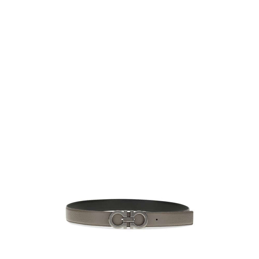 Gray Calf Leather Bos Taurus BeltGancini Belt by Ferragamo is a refined and versatile accessory made of grained leather with reversible, two-tone construction, ideal for adapting to different looks. The Gancini buckle with ruthenium finish features vertic