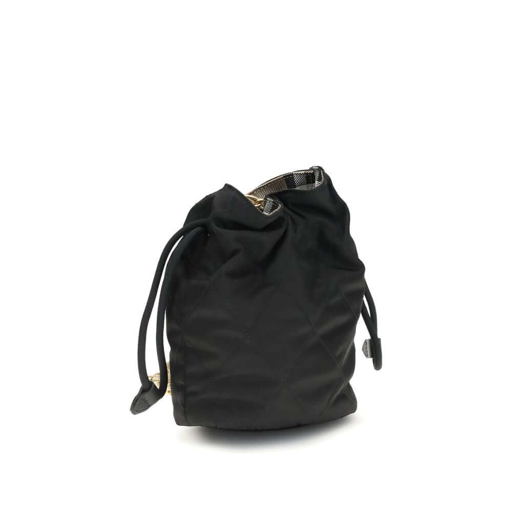 Black Nylon Shoulder BagHorseshoe Bucket Bag by Burberry is made of quilted canvas and embellished with the Equestrian Knight Design applique on the front. It features a metal chain shoulder strap and a drawstring closure, combining practicality and iconi