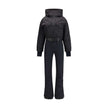 Black Polyester JumpsuitThe padded ski Suit by Moncler Grenoble combines technical precision with refined aesthetics. Filled with down for superior warmth and lightness, it features a front zip closure, adjustable drawstring hood, and a removable belt to