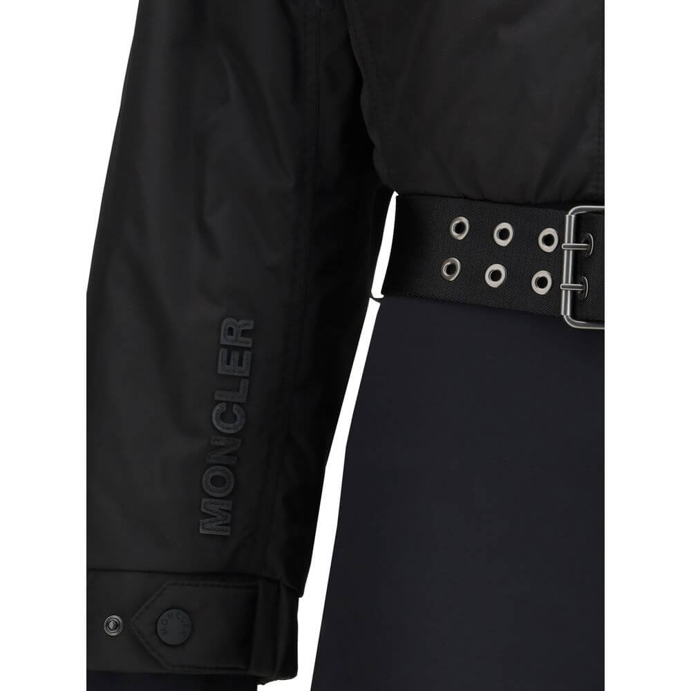 Black Polyester JumpsuitThe padded ski Suit by Moncler Grenoble combines technical precision with refined aesthetics. Filled with down for superior warmth and lightness, it features a front zip closure, adjustable drawstring hood, and a removable belt to