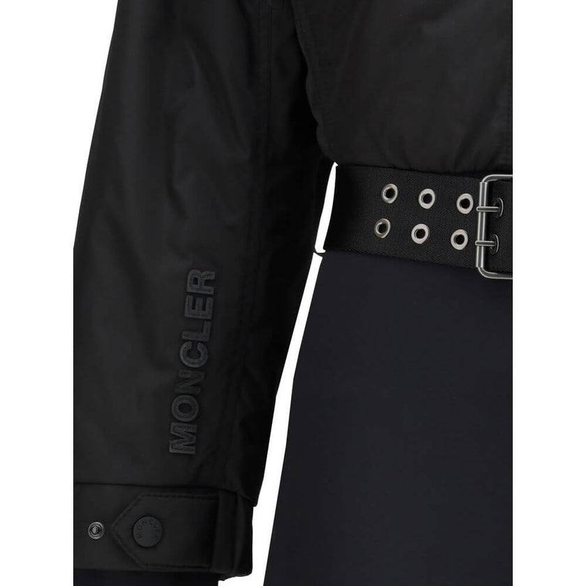 Black Polyester JumpsuitThe padded ski Suit by Moncler Grenoble combines technical precision with refined aesthetics. Filled with down for superior warmth and lightness, it features a front zip closure, adjustable drawstring hood, and a removable belt to