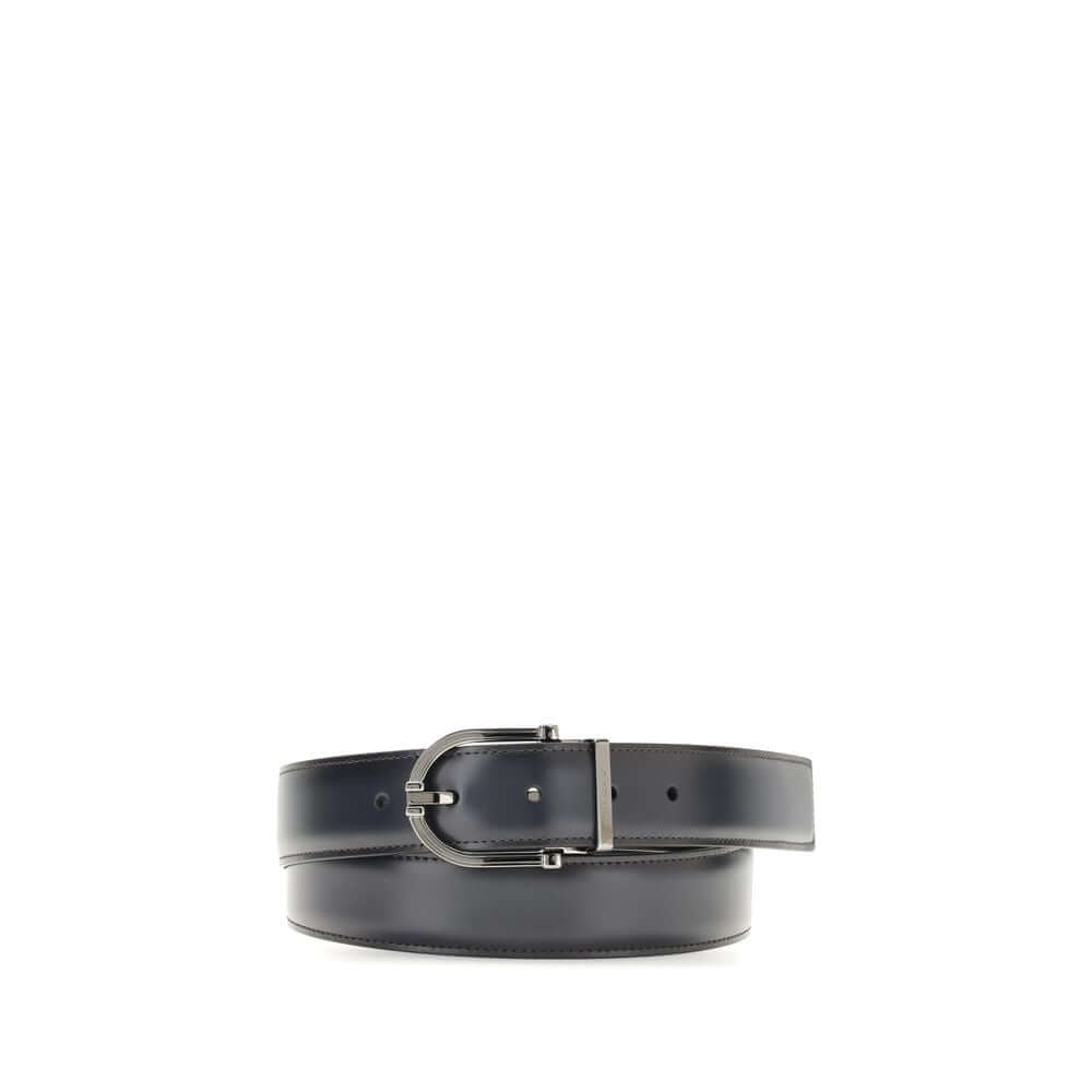 Black Calf Leather Bos Taurus Regular BeltReversible leather Belt by Ferragamo is made of soft calfskin and features a two-tone construction designed to offer maximum versatility. The geometric buckle with ruthenium finish is embellished with the signatur