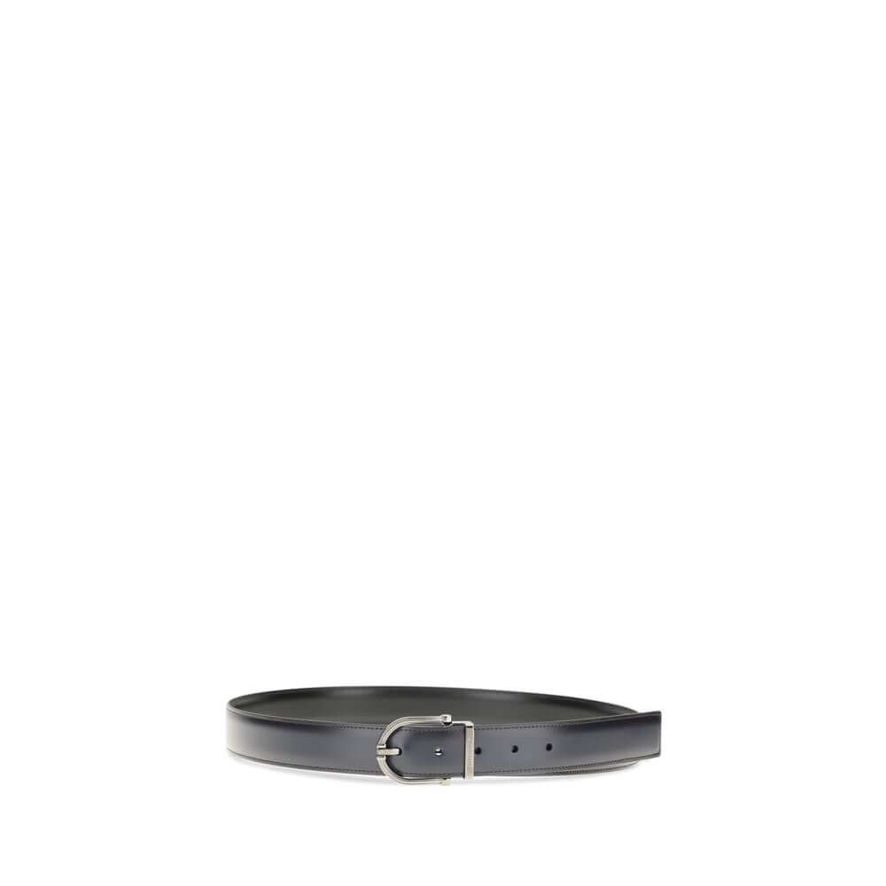 Black Calf Leather Bos Taurus Regular BeltReversible leather Belt by Ferragamo is made of soft calfskin and features a two-tone construction designed to offer maximum versatility. The geometric buckle with ruthenium finish is embellished with the signatur