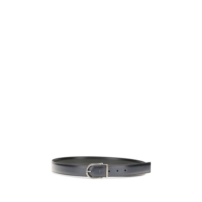 Black Calf Leather Bos Taurus Regular BeltReversible leather Belt by Ferragamo is made of soft calfskin and features a two-tone construction designed to offer maximum versatility. The geometric buckle with ruthenium finish is embellished with the signatur