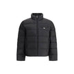 Re-nylon Down JacketPrada’s re-nylon Down Jacket combines sustainability and functionality with a modern design. It features a front zipper closure, two side pockets and a welt pocket on the chest. The distinctive triangular plaque sewn on the front and t