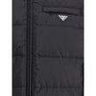 Re-nylon Down JacketPrada’s re-nylon Down Jacket combines sustainability and functionality with a modern design. It features a front zipper closure, two side pockets and a welt pocket on the chest. The distinctive triangular plaque sewn on the front and t