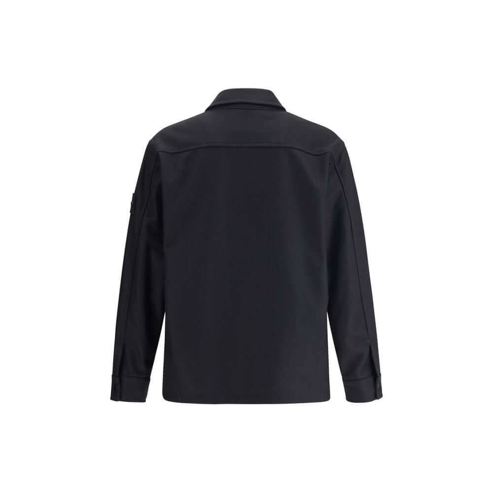 Black Fleece Wool CoatStone Island’s Wool Jacket is an overshirt with an essential and functional character. It features a classic collar, button closure and a patch pocket on the chest. The design is completed by the iconic logo on the left sleeve, a dis