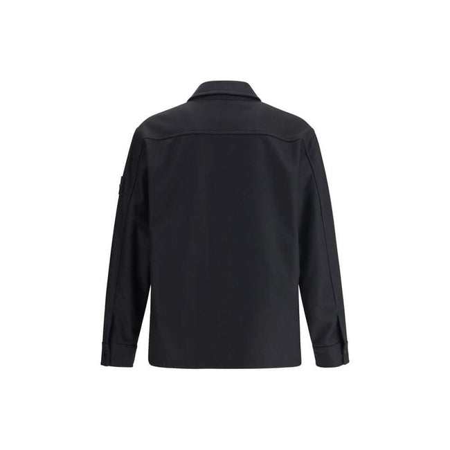 Black Fleece Wool CoatStone Island’s Wool Jacket is an overshirt with an essential and functional character. It features a classic collar, button closure and a patch pocket on the chest. The design is completed by the iconic logo on the left sleeve, a dis