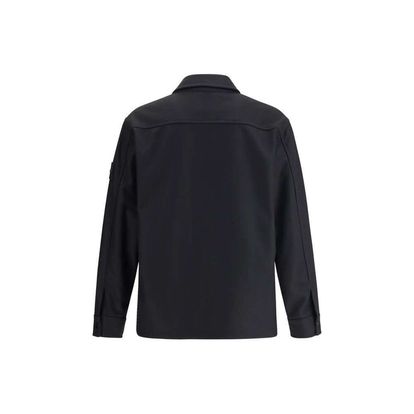 Black Fleece Wool CoatStone Island’s Wool Jacket is an overshirt with an essential and functional character. It features a classic collar, button closure and a patch pocket on the chest. The design is completed by the iconic logo on the left sleeve, a dis