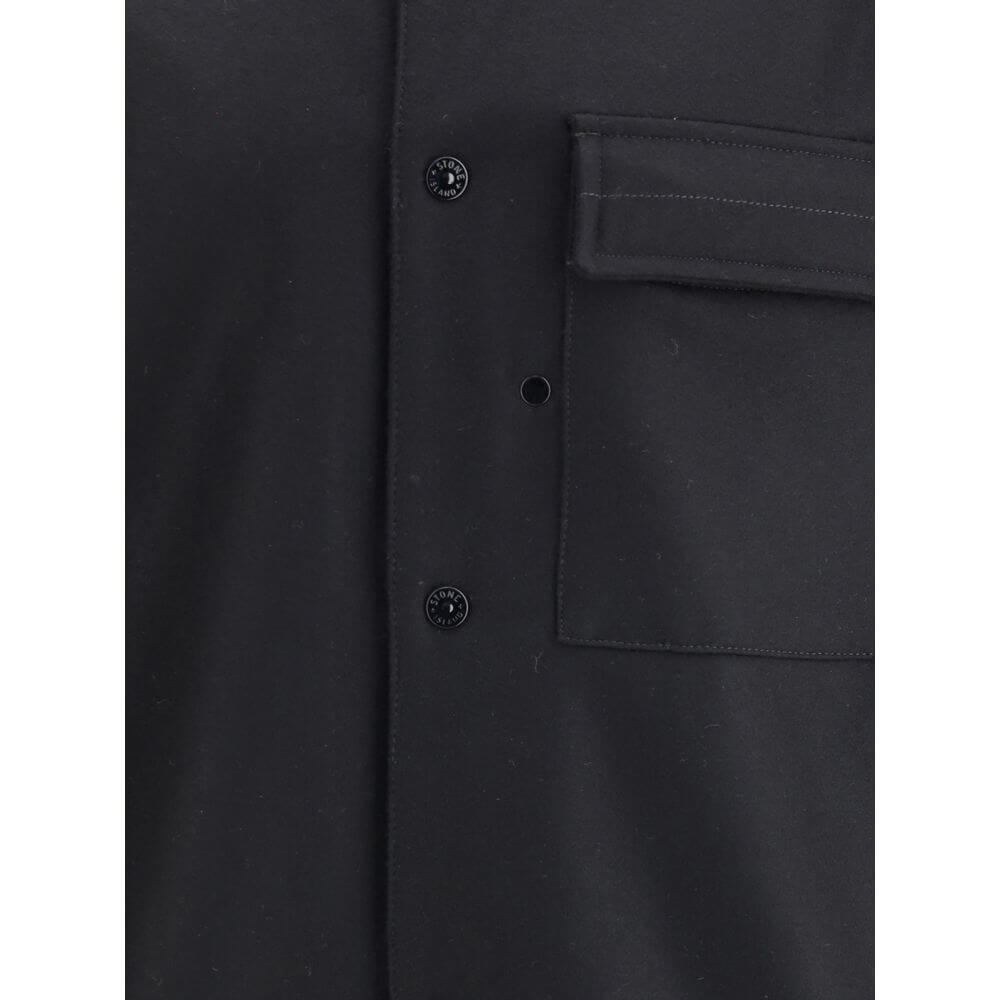 Black Fleece Wool CoatStone Island’s Wool Jacket is an overshirt with an essential and functional character. It features a classic collar, button closure and a patch pocket on the chest. The design is completed by the iconic logo on the left sleeve, a dis