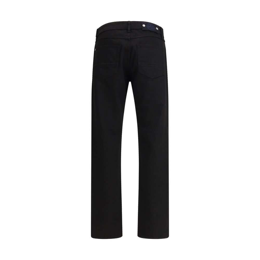 Black Cotton Jeans DenimThe denim Pants by Stone Island combine essential style with functional detailing. Featuring a regular waist with belt loops and a classic five-pocket design with rivets, they are built for durability and everyday wear. A versatile