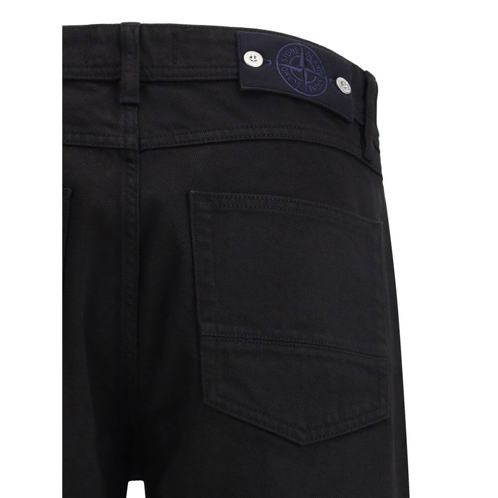 Black Cotton Jeans DenimThe denim Pants by Stone Island combine essential style with functional detailing. Featuring a regular waist with belt loops and a classic five-pocket design with rivets, they are built for durability and everyday wear. A versatile