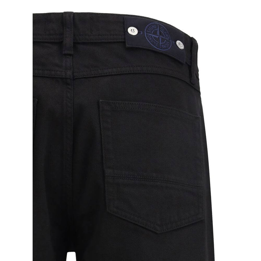 Black Cotton Jeans DenimThe denim Pants by Stone Island combine essential style with functional detailing. Featuring a regular waist with belt loops and a classic five-pocket design with rivets, they are built for durability and everyday wear. A versatile