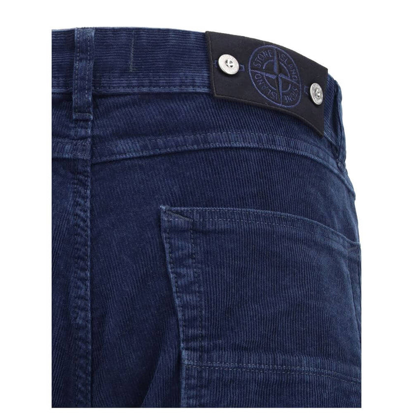 Blue Cotton Straight-Leg JeansThe straight-leg corduroy Trousers by Stone Island blend refined style with utilitarian spirit. Crafted from cotton corduroy, they feature a concealed zip and button closure, two slanted front pockets, and two back welt pocke