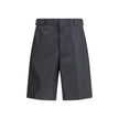 Black Recycled Polyamide Bermuda ShortsThe Re-Nylon Bermuda Shorts by Prada merge contemporary design with a sustainable ethos. Crafted from ECONYL®, a regenerated nylon yarn produced from recycled ocean plastics, fishing nets, and textile fibers, they em