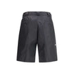 Black Recycled Polyamide Bermuda ShortsThe Re-Nylon Bermuda Shorts by Prada merge contemporary design with a sustainable ethos. Crafted from ECONYL®, a regenerated nylon yarn produced from recycled ocean plastics, fishing nets, and textile fibers, they em